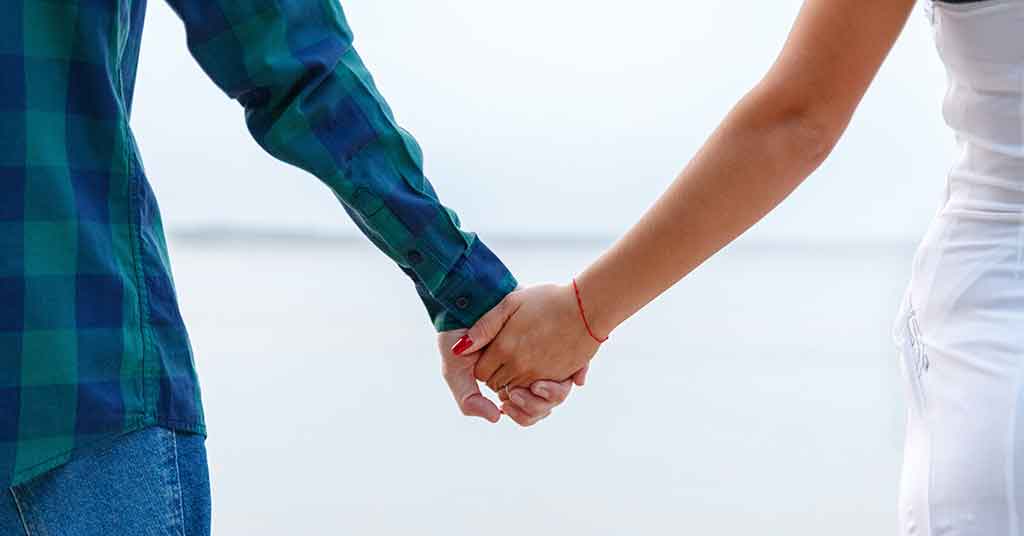 two people holding hands