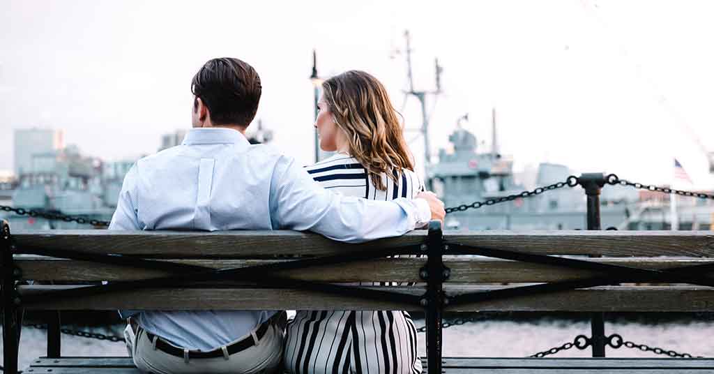 man and woman sitting on a bench-signs of relationship compatibility