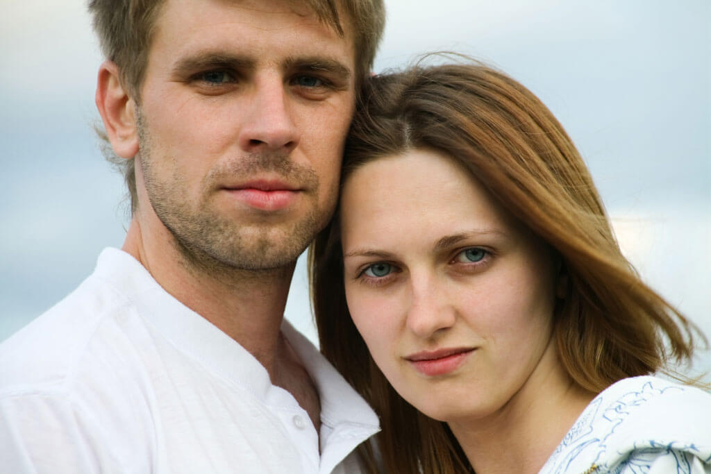 head shot of man and women standing