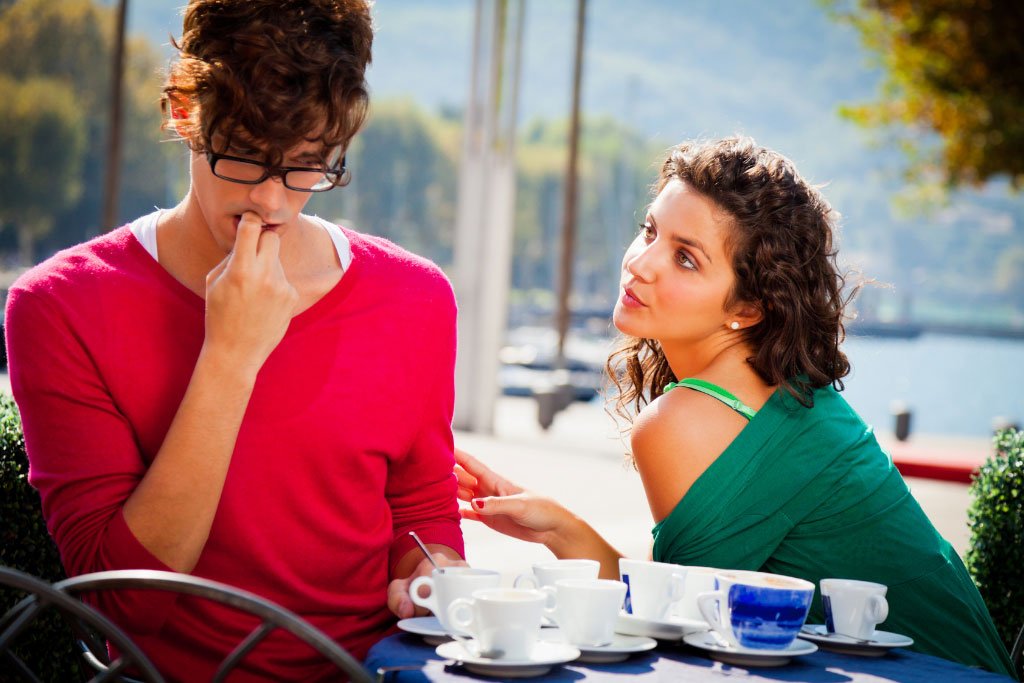 Girl and a boy on coffee table for a date