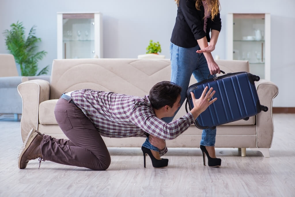 Man trying to stop woman from breakup