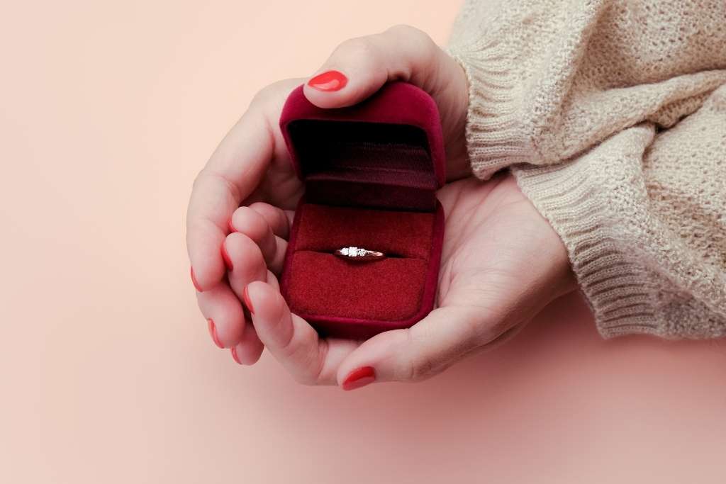 women show a wedding ring