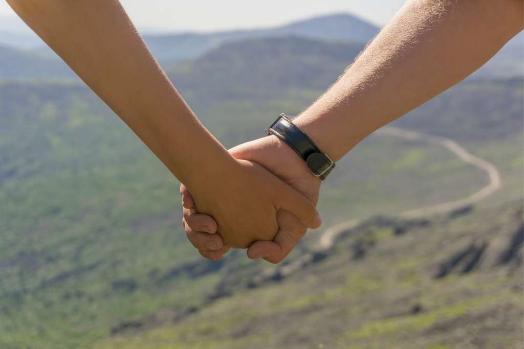 Man and woman walking and holding hands