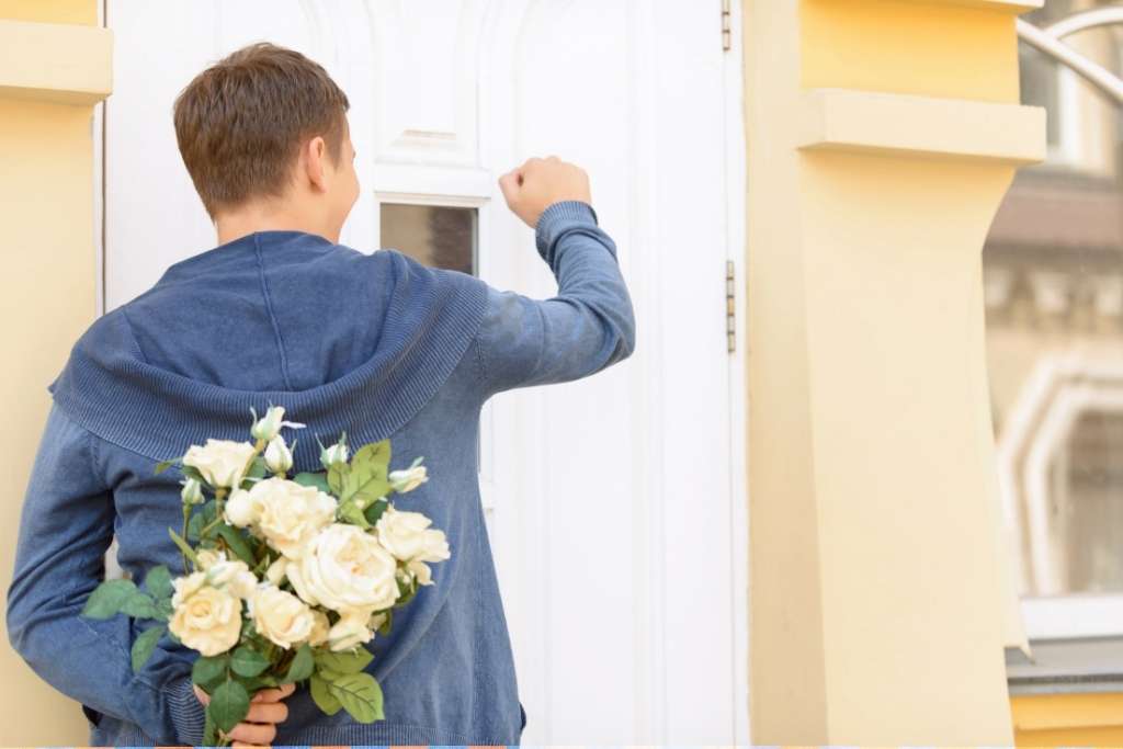Young Guy holding bouquet of flowers