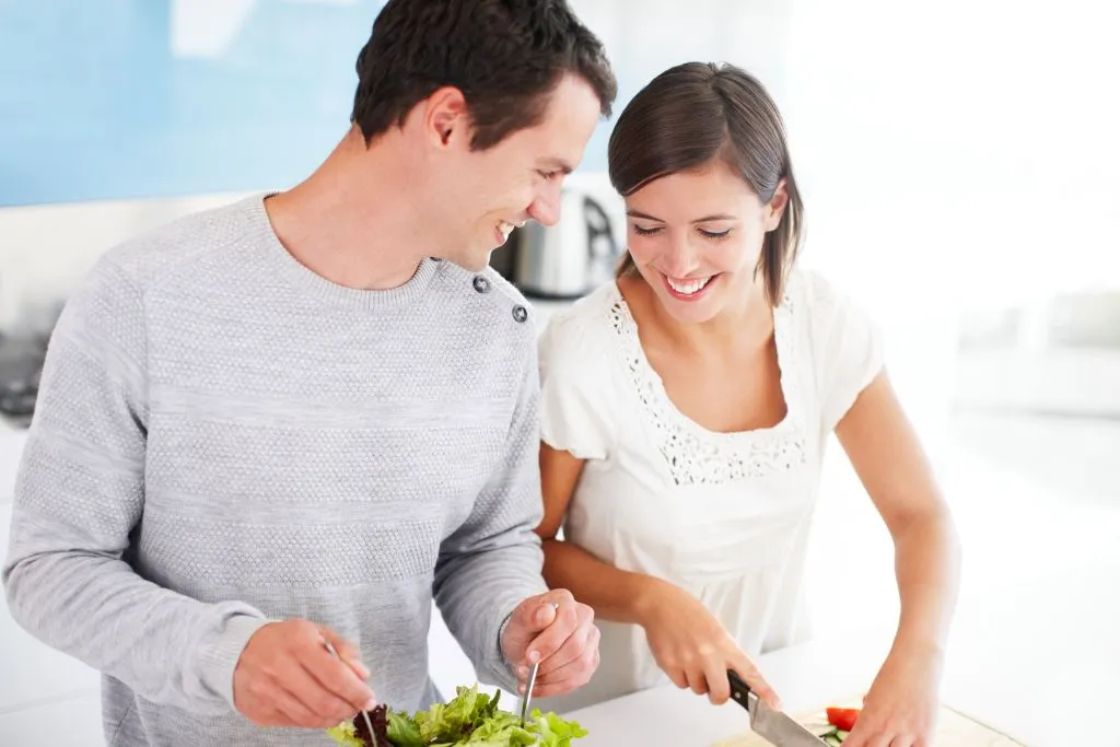 man and woman cooking 