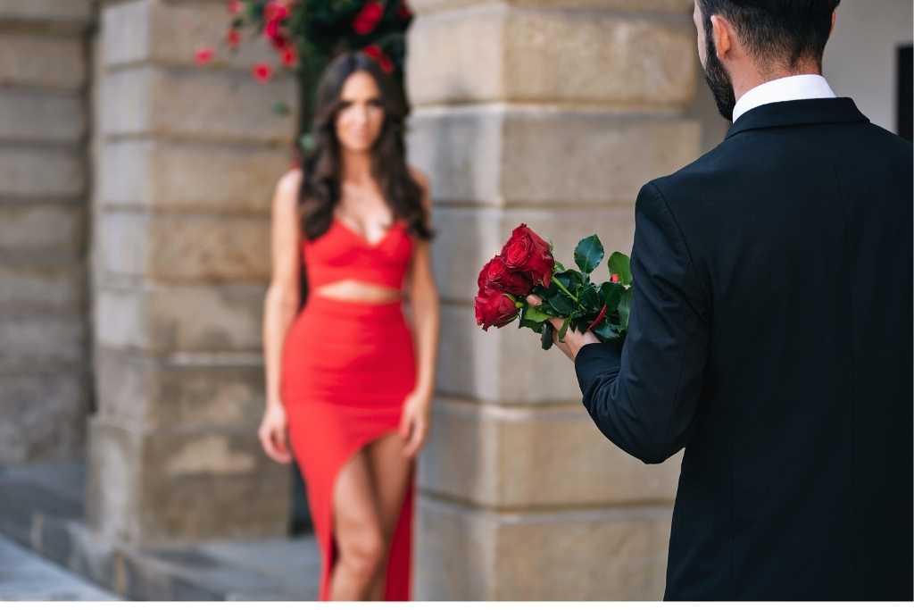 man giving love flower to wife