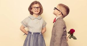 A young boy is ready to make a move and tell his girl he loves her.