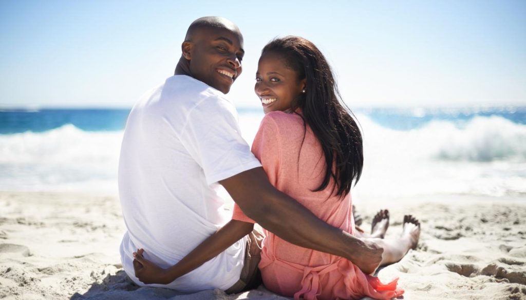 Platonic soulmate enjoying a peaceful moment on the beach, basking in the sun and feeling the gentle breeze.